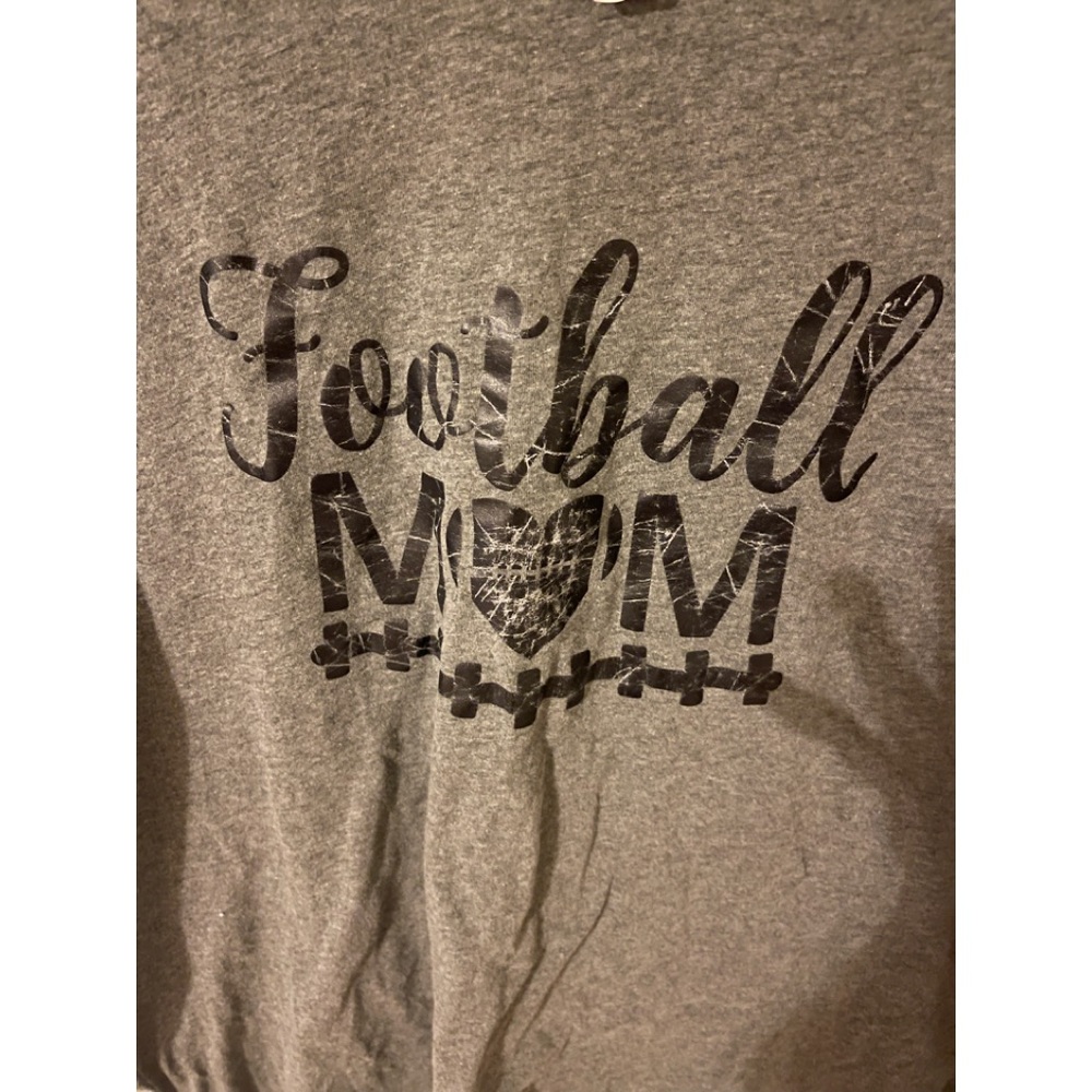 Distressed woman’s football shirt size XL